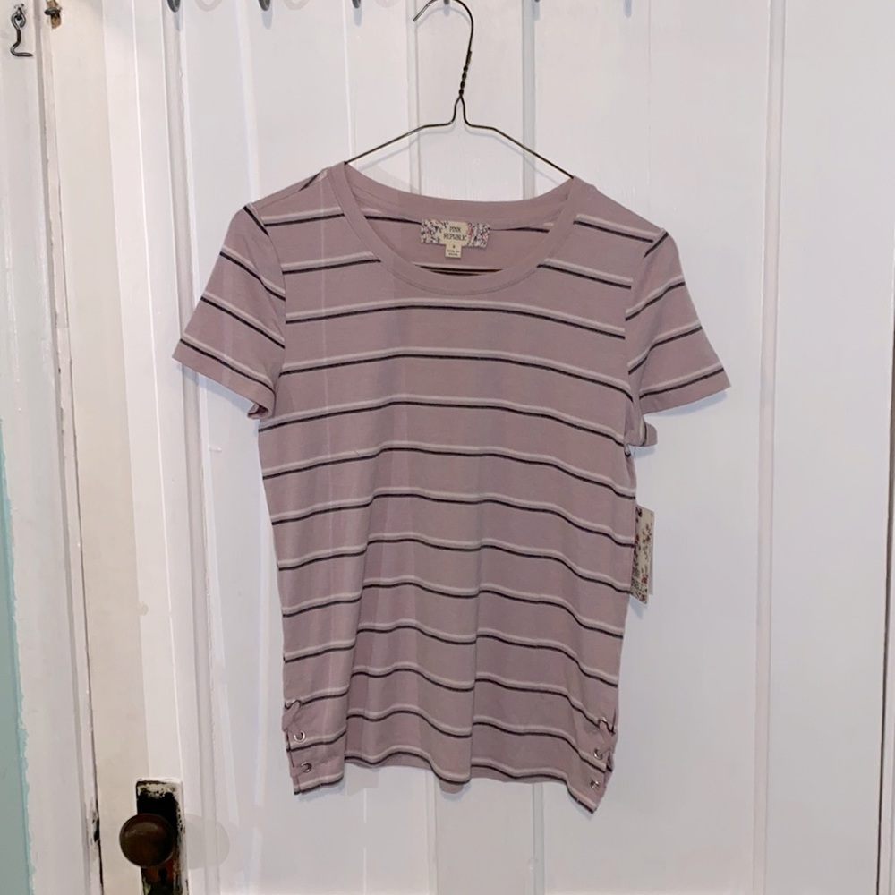 purple t-shirt with black and white stripes